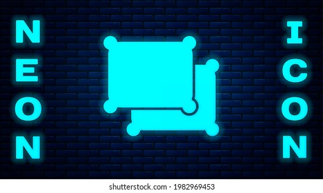 Glowing neon Rectangular pillow icon isolated on brick wall background. Cushion sign.  Vector