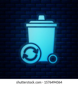Glowing neon Recycle bin with recycle symbol icon isolated on brick wall background. Trash can icon. Garbage bin sign. Recycle basket sign.  Vector Illustration