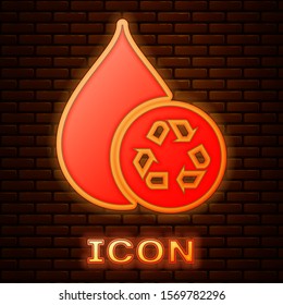 Glowing neon Recycle clean aqua icon isolated on brick wall background. Drop of water with sign recycling.  Vector Illustration