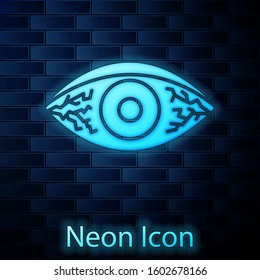 Glowing neon Reddish eye due to viral, bacterial or allergic conjunctivitis icon isolated on brick wall background.  Vector Illustration