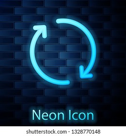 Glowing neon Refresh icon isolated on brick wall background. Reload symbol. Rotation arrows in a circle sign. Vector Illustration