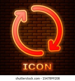 Glowing neon Refresh icon isolated on brick wall background. Reload symbol. Rotation arrows in a circle sign.  Vector Illustration