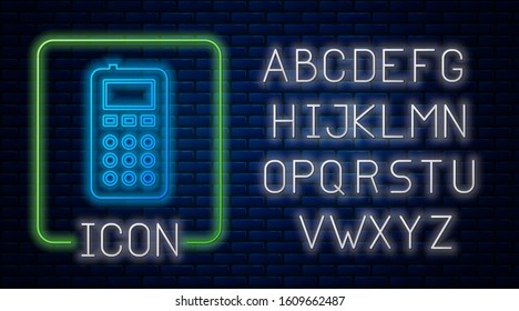 Glowing neon Remote control icon isolated on brick wall background. Neon light alphabet. Vector Illustration