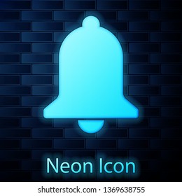 Glowing neon Ringing bell icon isolated on brick wall background. Alarm symbol, service bell, handbell sign, notification symbol. Vector Illustration