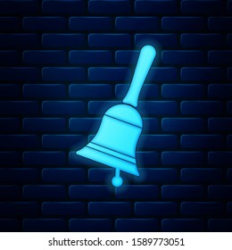 Glowing neon Ringing bell icon isolated on brick wall background. Alarm symbol, service bell, handbell sign, notification symbol. Vector Illustration