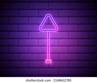 Glowing neon Road traffic sign. Signpost icon isolated on brick wall background. Pointer symbol. Isolated street information sign. Direction sign. Vector.