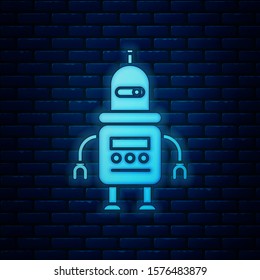 Glowing neon Robot icon isolated on brick wall background.  Vector Illustration