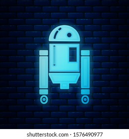 Glowing neon Robot icon isolated on brick wall background.  Vector Illustration