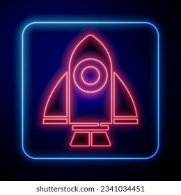 Glowing neon Rocket ship icon isolated on blue background. Space travel.  Vector