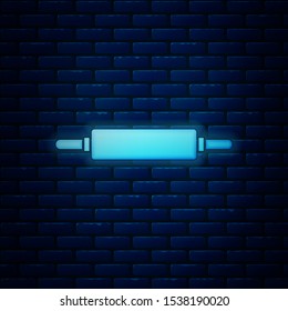 Glowing neon Rolling pin icon isolated on brick wall background.  Vector Illustration