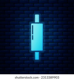 Glowing neon Rolling pin icon isolated on brick wall background.  Vector