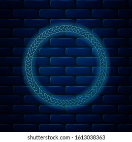 Glowing neon Rope frame icon isolated on brick wall background. Frames from nautical rope. Round marine rope for decoration.  Vector Illustration