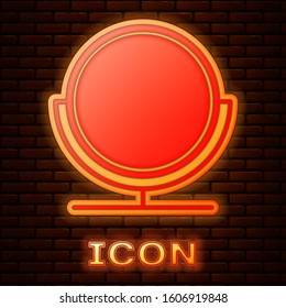 Glowing neon Round makeup mirror icon isolated on brick wall background.  Vector Illustration