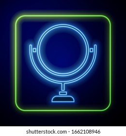 Glowing neon Round makeup mirror icon isolated on blue background. 8 March. International Happy Women Day.  Vector Illustration