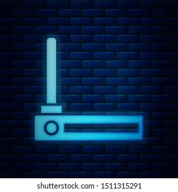 Glowing neon Router and wi-fi signal symbol icon isolated on brick wall background. Wireless ethernet modem router. Computer technology internet.  Vector Illustration