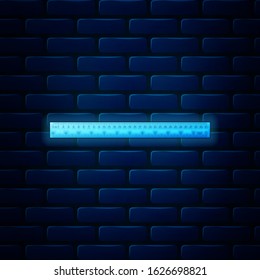 Glowing neon Ruler icon isolated on brick wall background. Straightedge symbol.  Vector Illustration
