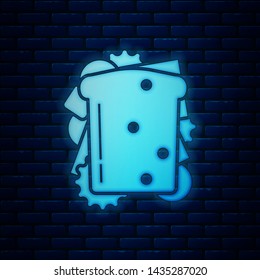 Glowing neon Sandwich icon isolated on brick wall background. Hamburger icon. Burger food symbol. Cheeseburger sandwich sign. Street fast food menu.  Vector Illustration