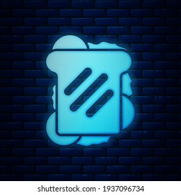 Glowing neon Sandwich icon isolated on brick wall background. Hamburger icon. Burger food symbol. Cheeseburger sign. Street fast food menu.  Vector