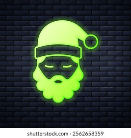 Glowing neon Santa Claus hat and beard icon isolated on brick wall background. Merry Christmas and Happy New Year.  Vector