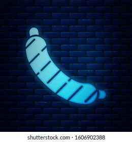 Glowing neon Sausage icon isolated on brick wall background. Grilled sausage and aroma sign.  Vector Illustration