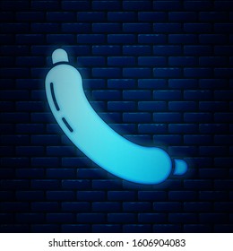 Glowing neon Sausage icon isolated on brick wall background. Grilled sausage and aroma sign.  Vector Illustration