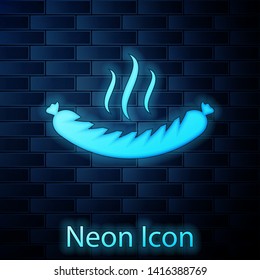 Glowing neon Sausage with steam icon isolated on brick wall background. Grilled sausage and aroma sign. Vector Illustration