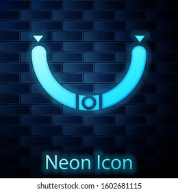 Glowing neon Sausage with steam icon isolated on brick wall background. Grilled sausage and aroma sign.  Vector Illustration