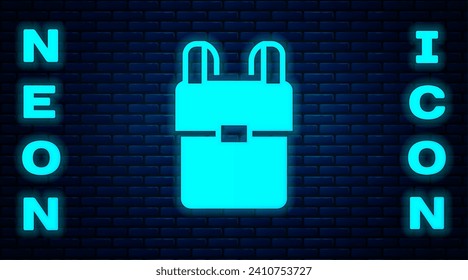 Glowing neon School backpack icon isolated on brick wall background.  Vector