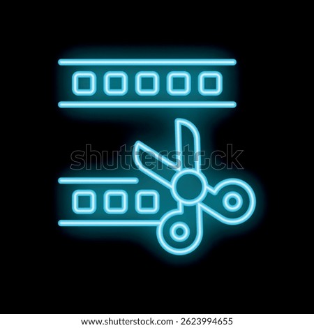 Glowing neon scissors are cutting a strip of film on a black background