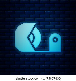 Glowing neon Scotch icon isolated on brick wall background. Roll of adhesive tape for work and repair. Sticky packing tape. Office tool and stuff.  Vector Illustration
