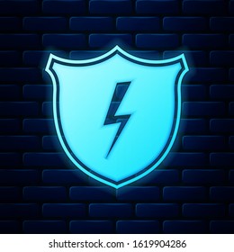 Glowing neon Secure shield with lightning icon isolated on brick wall background. Security, safety, protection, privacy concept.  Vector Illustration
