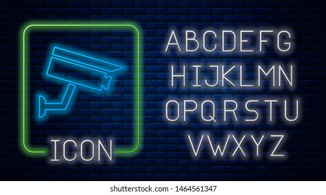 Glowing neon Security camera icon isolated on brick wall background. Neon light alphabet. Vector Illustration