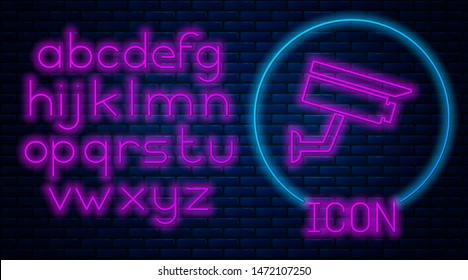 Glowing neon Security camera icon isolated on brick wall background. Neon light alphabet. Vector Illustration