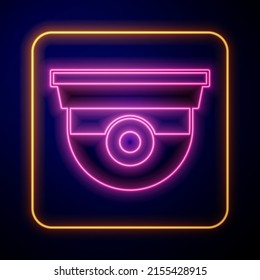 Glowing neon Security camera icon isolated on black background.  Vector
