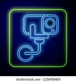 Glowing neon Security camera icon isolated on blue background.  Vector