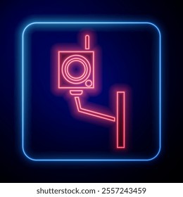 Glowing neon Security camera icon isolated on blue background.  Vector Illustration