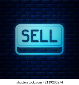 Glowing neon Sell button icon isolated on brick wall background. Financial and stock investment market concept.  Vector