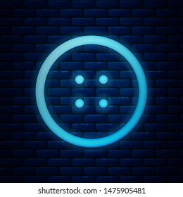 Glowing neon Sewing button for clothes icon isolated on brick wall background. Clothing button.  Vector Illustration