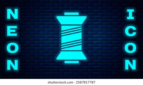 Glowing neon Sewing thread on spool icon isolated on brick wall background. Yarn spool. Thread bobbin.  Vector Illustration