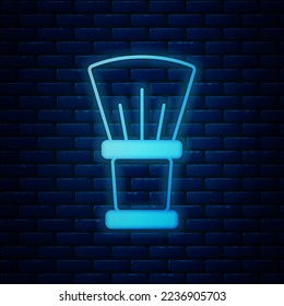 Glowing neon Shaving brush icon isolated on brick wall background. Barbershop symbol.  Vector