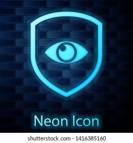 Glowing neon Shield and eye icon isolated on brick wall background. Security, safety, protection, privacy concept. Vector Illustration