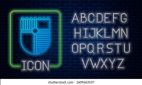 Glowing neon Shield for game icon isolated on brick wall background. Neon light alphabet. Vector Illustration