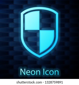 Glowing neon Shield icon isolated on brick wall background. Guard sign. Vector Illustration