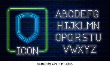 Glowing neon Shield icon isolated on brick wall background. Guard sign. Neon light alphabet. Vector Illustration