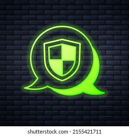 Glowing neon Shield icon isolated on brick wall background. Insurance concept. Guard sign. Security, safety, protection, privacy concept.  Vector