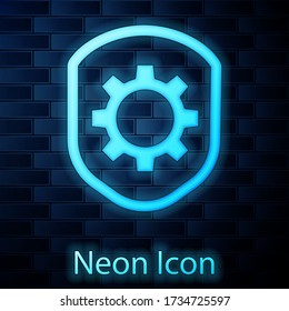 Escudo de neón brillante con el icono del engranaje de ajuste aislado en el fondo de la pared de ladrillo. Ajuste, servicio, mantenimiento, reparación, arreglo. Ilustración vectorial