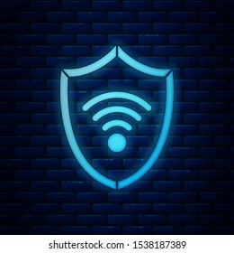 Glowing neon Shield with WiFi wireless internet network symbol icon isolated on brick wall background. Protection safety concept.  Vector Illustration
