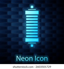 Glowing neon Shock absorber icon isolated on brick wall background.  Vector