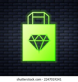 Glowing neon Shopping bag jewelry icon isolated on brick wall background.  Vector