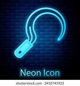 Glowing neon Sickle icon isolated on brick wall background. Reaping hook sign.  Vector